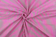 Load image into Gallery viewer, This fabric features stripes in fuchsia and white.  The versatile lightweight fabric is soft and easy to sew.  It would be great for quilting, crafting and sewing projects.  
