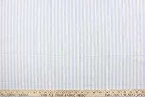 This fabric features stripes in baby blue and white.  The versatile lightweight fabric is soft and easy to sew.  It would be great for quilting, crafting and sewing projects.  