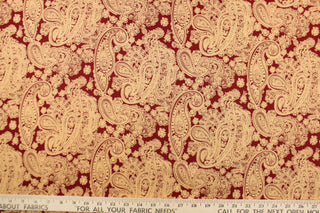  This fabric features a large paisley print in light orange on a red background.  The versatile lightweight fabric is soft and easy to sew.  It would be great for quilting, crafting and sewing projects.  