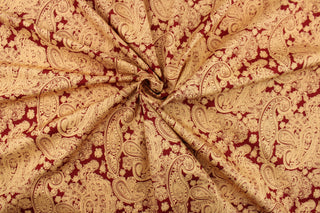  This fabric features a large paisley print in light orange on a red background.  The versatile lightweight fabric is soft and easy to sew.  It would be great for quilting, crafting and sewing projects.  