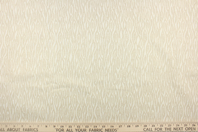 This 4-pass blackout drapery lining features a wheat design in light beige and off white.  It is used to keep rooms cooler in the summer and warmer in the winter.  The fabric lining adds fullness to your window treatments.  It is light weight and easy to sew and simple to maintain.