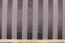 Load image into Gallery viewer,  This fabric features a stripe design in a rich purple gray  with  a slight shine. 
