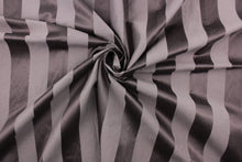 Load image into Gallery viewer,  This fabric features a stripe design in a rich purple gray  with  a slight shine. 
