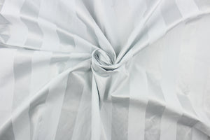 This fabric features a stripe design in white with  a slight shine.