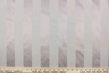 Load image into Gallery viewer,  This fabric features a stripe design in gray with purple undertones  with  a slight shine.

