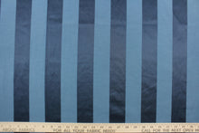Load image into Gallery viewer, This fabric features a stripe design in blue with  a slight shine.
