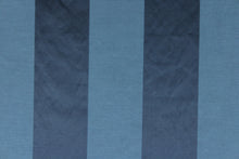 Load image into Gallery viewer, This fabric features a stripe design in blue with  a slight shine.
