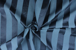 This fabric features a stripe design in blue with  a slight shine.