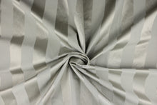 Load image into Gallery viewer, This fabric features a stripe design in gray with  a slight shine. 
