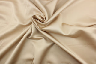 This multi-purpose mock linen in tea (dark champagne color) has a soft luxurious feel with a subtle sheen.  It would be great for home decor, window treatments, pillows, duvet covers, tote bags and more.  We offer Shauna in other colors.