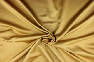 This multi-purpose mock linen in pale gold has a soft luxurious feel with a subtle sheen.  It would be great for home decor, window treatments, pillows, duvet covers, tote bags and more.  We offer Shauna in other colors.