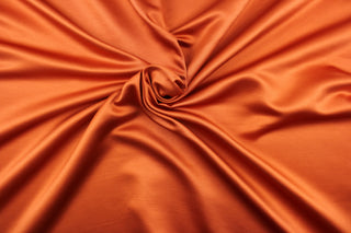 This multi-purpose mock linen in papaya (deep orange) has a soft luxurious feel with a subtle sheen.  It would be great for home decor, window treatments, pillows, duvet covers, tote bags and more.  We offer Shauna in other colors.