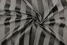 Load image into Gallery viewer, This fabric features a stripe design in dark gray with  a slight shine. 
