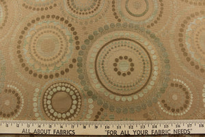  This contemporary geometric design features overlapping circles and dots in beige, green tones, gold and champagne colors. 