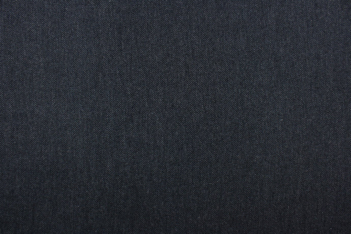 This wool features a herringbone design in blue and gray 