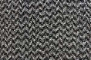 This wool features a herringbone design in black and white . 