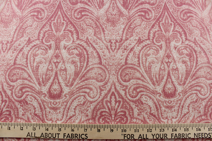 This elegant fabric from the Enchanted Garden collection offers a beautiful damask design in shades of pink , peach pink and blush pink on a white background.
