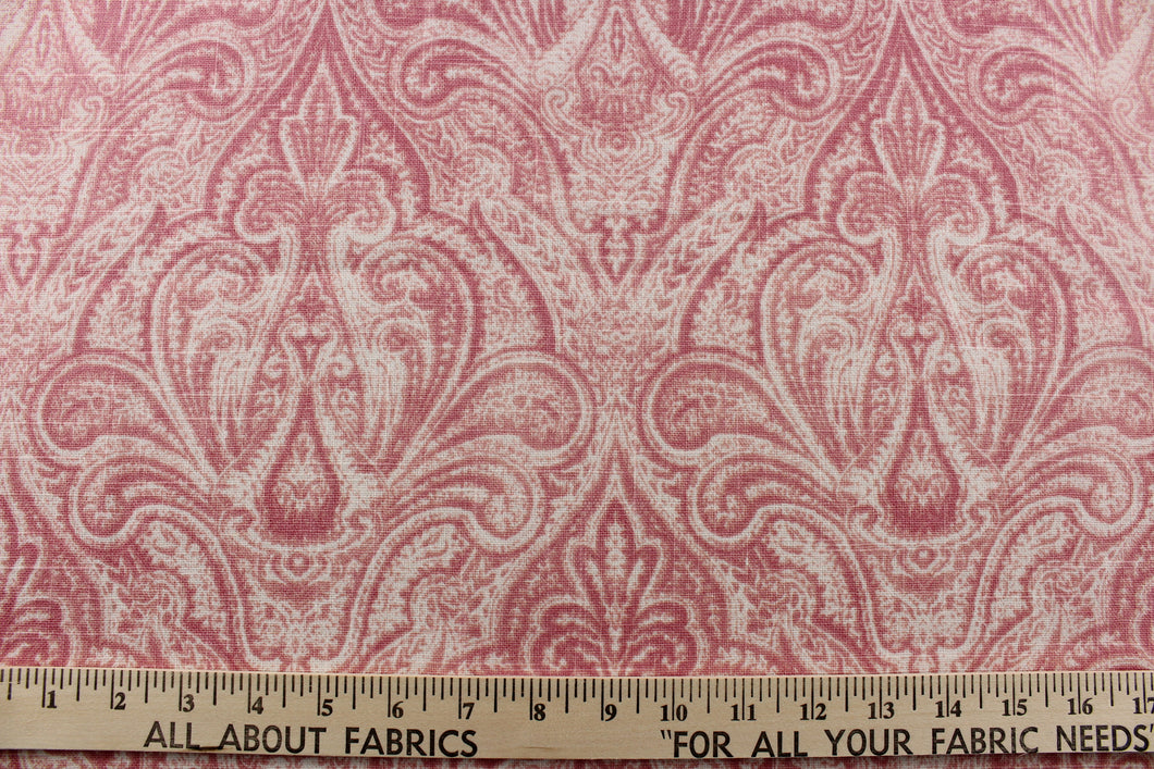 This elegant fabric from the Enchanted Garden collection offers a beautiful damask design in shades of pink , peach pink and blush pink on a white background.