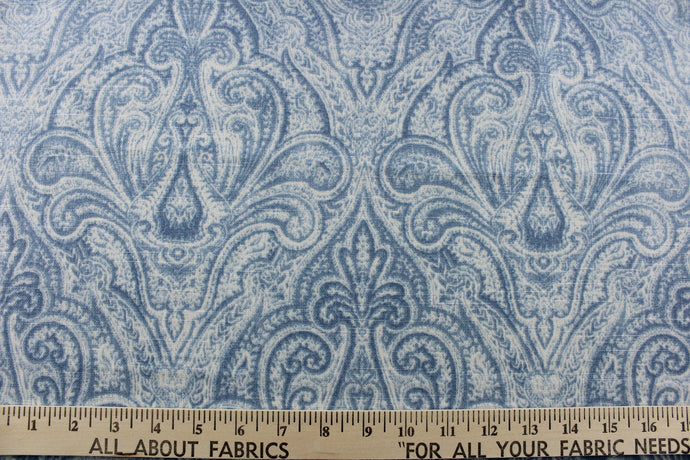   This elegant fabric from the Enchanted Garden collection offers a beautiful damask design in an ocean blue and dusty blue on a white background.