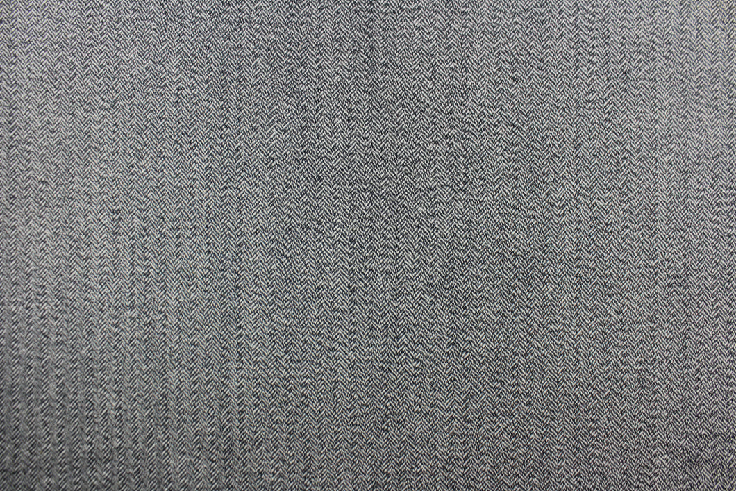  This wool features a herringbone design in blue gray and lighter gray.