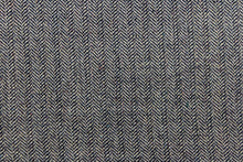 Load image into Gallery viewer, This wool features a herringbone design in blue and light beige or gray with hints of varying colors. 
