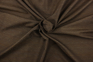 This fabric in brown with hints of beige and light blue offers beautiful design, style and color to any space in your home.  It has a soft workable feel and is perfect for window treatments (draperies, valances, curtains, and swags), bed skirts, duvet covers, light upholstery, pillow shams and accent pillows.  