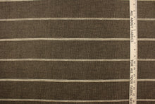 Load image into Gallery viewer, This fabric features a horizontal stripe design in light beige against   brown. 
