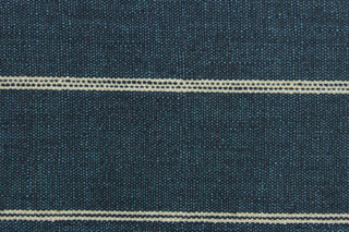 This fabric features a stripe design in a light beige against a rich blue. 