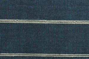 This fabric features a stripe design in a light beige against a rich blue. 