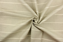 Load image into Gallery viewer, This fabric features a horizontal stripe design in cream against light beige. 
