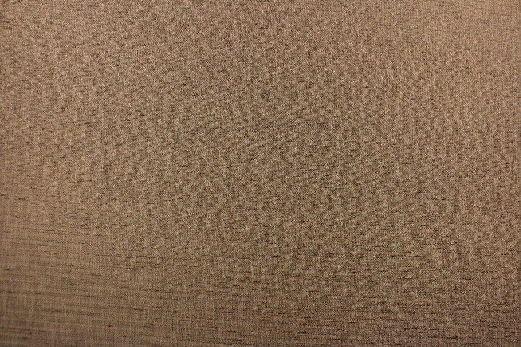  Voltaire is a woven, textured fabric in brown.  It has a slub yarn running across the the fabric which creates the look of silk with a soft, drapable hand.  The weight is suited for draperies, light upholstery, headboards, decorative pillows, coverlets and cornice boards.  We offer Voltaire in several different colors.