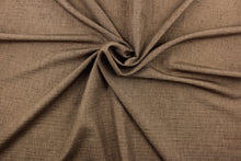Load image into Gallery viewer,  Voltaire is a woven, textured fabric in brown.  It has a slub yarn running across the the fabric which creates the look of silk with a soft, drapable hand.  The weight is suited for draperies, light upholstery, headboards, decorative pillows, coverlets and cornice boards.  We offer Voltaire in several different colors.
