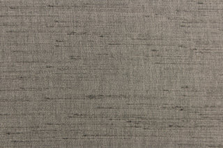  Voltaire is a woven, textured fabric in dark grey.  It has a slub yarn running across the the fabric which creates the look of silk with a soft, drapable hand.  The weight is suited for draperies, light upholstery, headboards, decorative pillows, coverlets and cornice boards.  We offer Voltaire in several different colors.