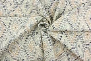 This fabric features a geometric design of diamonds in blue, white, tan and a seafoam . 