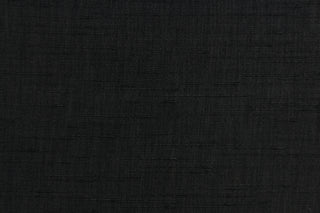 Voltaire is a woven, textured fabric in black.  It has a slub yarn running across the the fabric which creates the look of silk with a soft, drapable hand.  The weight is suited for draperies, light upholstery, headboards, decorative pillows, coverlets and cornice boards.  We offer Voltaire in several different colors.