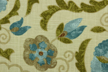 Load image into Gallery viewer, This multi purpose fabric features a floral and vine design in shades of blue, brown, dark khaki and olive green on a beige background. It can be used for several different statement projects including window accents (drapery, curtains and swags), decorative pillows, hand bags, bed skirts, duvet covers, upholstery and craft projects.  It has a soft workable feel yet is stable and durable.
