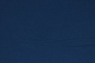 Midnight is a solid blue cotton jersey fabric that has a 4-way stretch and is soft, durable, breathable and will allow movements of the body.  Uses include t-shirts, sportswear, loungewear, leggings, children's apparel, bedding and sheets.  We offer a variety of jersey fabrics.