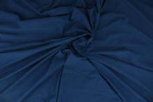 Load image into Gallery viewer, Midnight is a solid blue cotton jersey fabric that has a 4-way stretch and is soft, durable, breathable and will allow movements of the body.  Uses include t-shirts, sportswear, loungewear, leggings, children&#39;s apparel, bedding and sheets.  We offer a variety of jersey fabrics.
