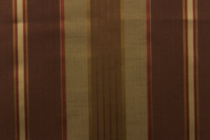  Featuring a multi width striped pattern  in colors of gold, red and brown with a  slight sheen to enhance the rich colors and overall design. 