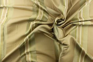  This rich woven yarn dyed fabric features bold multi width striped pattern in khaki and gold against a khaki background. 