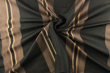 Load image into Gallery viewer,  This rich woven yarn dyed fabric features bold multi width striped pattern in brown and gold on a black background
