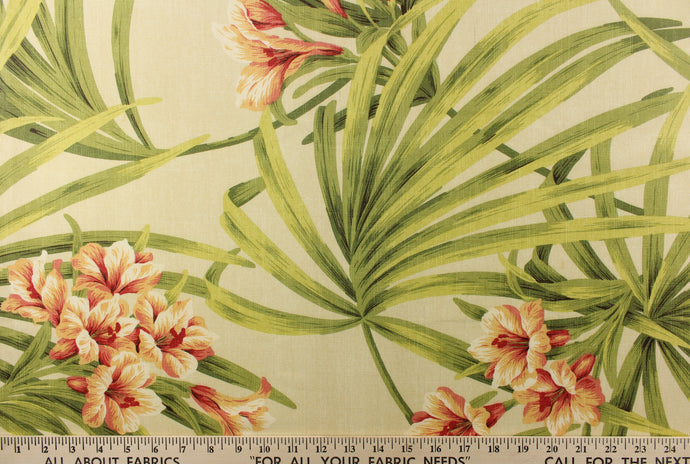 A beautiful large floral print in green, peach, coral, pink, orange and red set against a cream background.