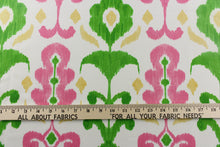 Load image into Gallery viewer, This fun design features an ikat pattern in  pink, green and yellow colors on a white background. 
