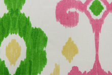 Load image into Gallery viewer, This fun design features an ikat pattern in  pink, green and yellow colors on a white background. 
