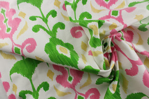 This fun design features an ikat pattern in  pink, green and yellow colors on a white background. 