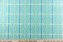Load image into Gallery viewer,   This very unique fabric with a tropical theme, feature a geometric pattern of bamboo looking diamonds, stripes and circles in a cabana blue color with lime green and turquoise blue colors along with some white strips.
