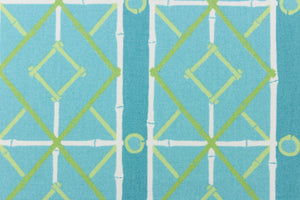   This very unique fabric with a tropical theme, feature a geometric pattern of bamboo looking diamonds, stripes and circles in a cabana blue color with lime green and turquoise blue colors along with some white strips.
