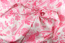 Load image into Gallery viewer, This fabric features a  large floral vine design with  colors in varying shades of pink flowers on a white background. 
