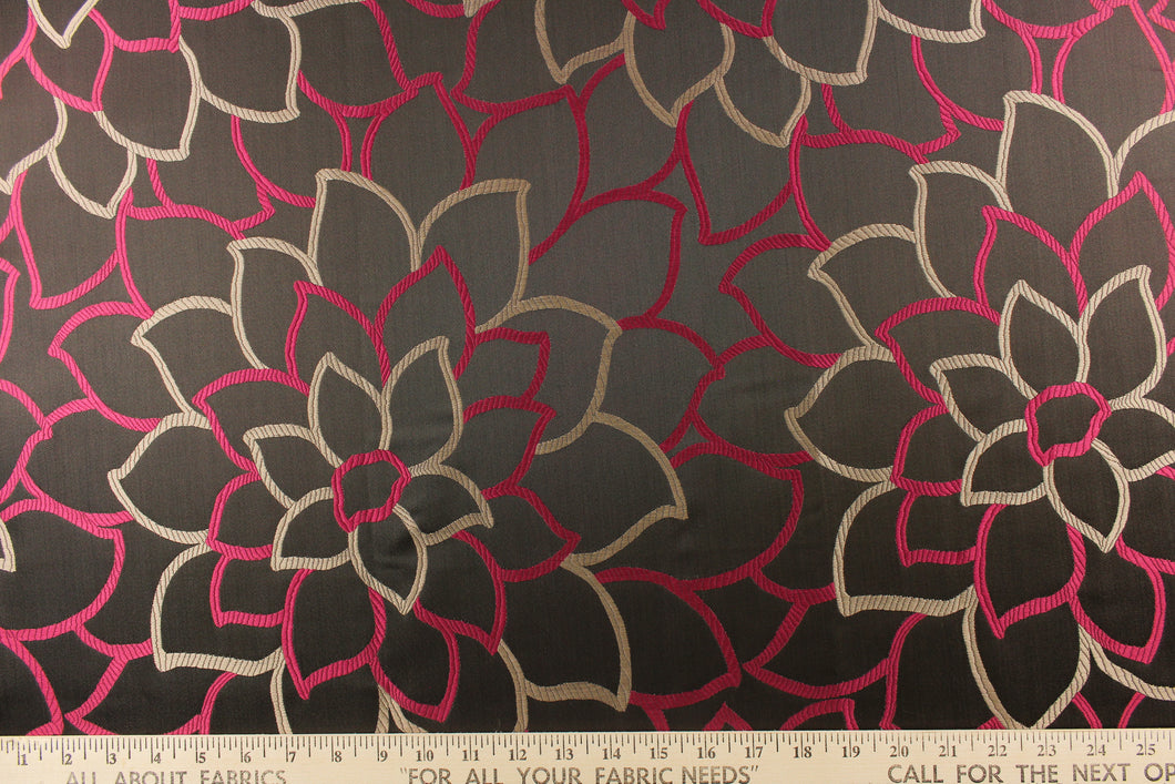 This elegant jacquard fabric features a woven floral design in a deep pink and taupe against a dark brown. 