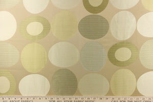  Stylish, modern and contemporary best describe this geometric pattern of circles and ovals in champagne or cream and gold tones on a beige background.